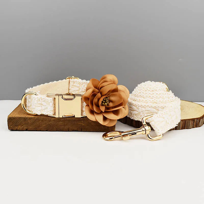 Leaves and lace pattern dog wedding collar and leash set with vest and floral accessories on a white background.