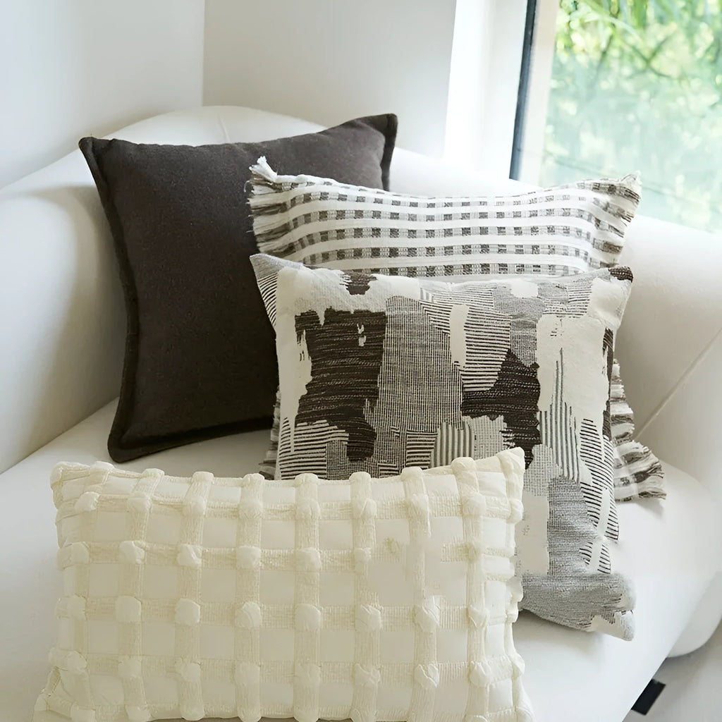 Coffee brown Chinese classical style cushion with striped and patchwork designs on a sofa.