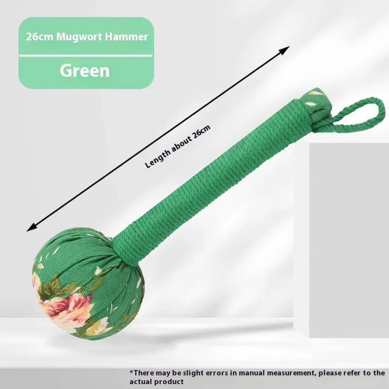 Argy wormwood handheld massage hammer in green colour on a plain background