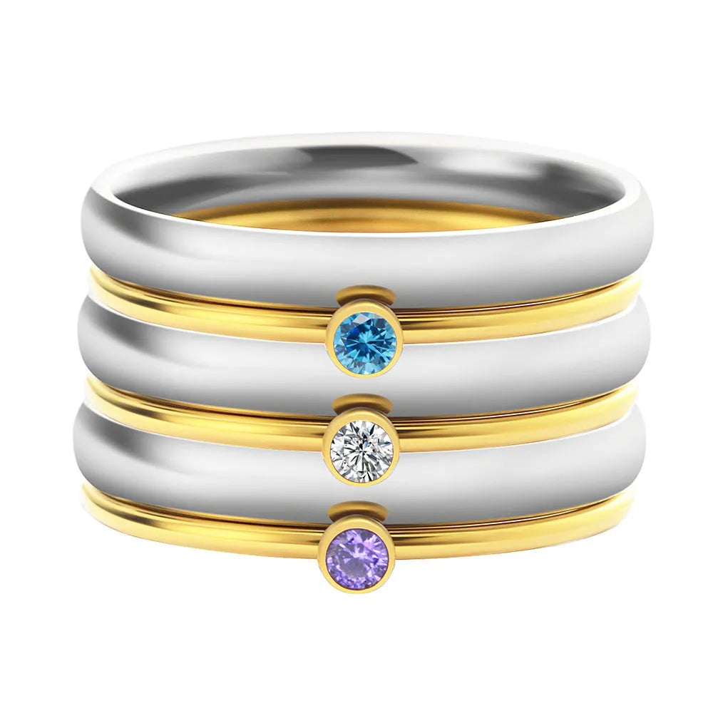 December colour birthstone engraved titanium steel ring with geometry shape on a grey background.