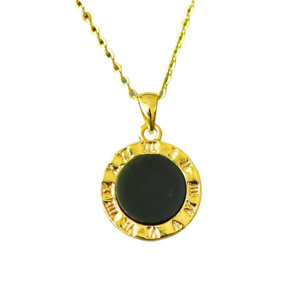 Flat disc pendant of grey and ink blue Hetian Jade with a decorative copper inlay on a necklace chain.