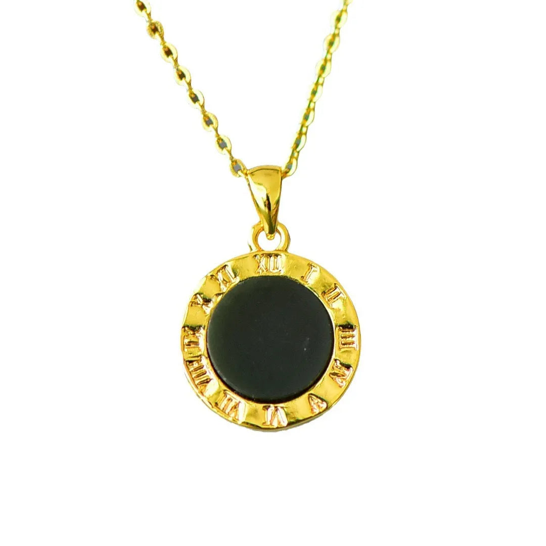Flat disc pendant of grey and ink blue Hetian Jade with a decorative copper inlay on a necklace chain.