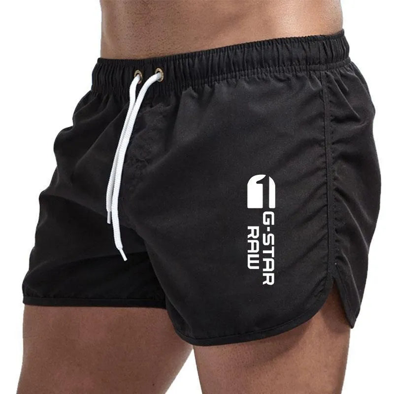 Men's thin hemp-blended polyester sport shorts in multiple colours on a mannequin, showing elastic waistband.