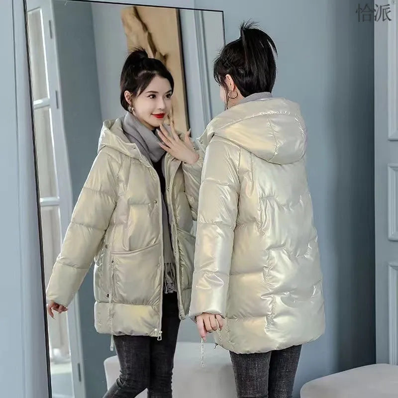 Women's loose-fit hooded winter jacket in blue with thick cotton filling.