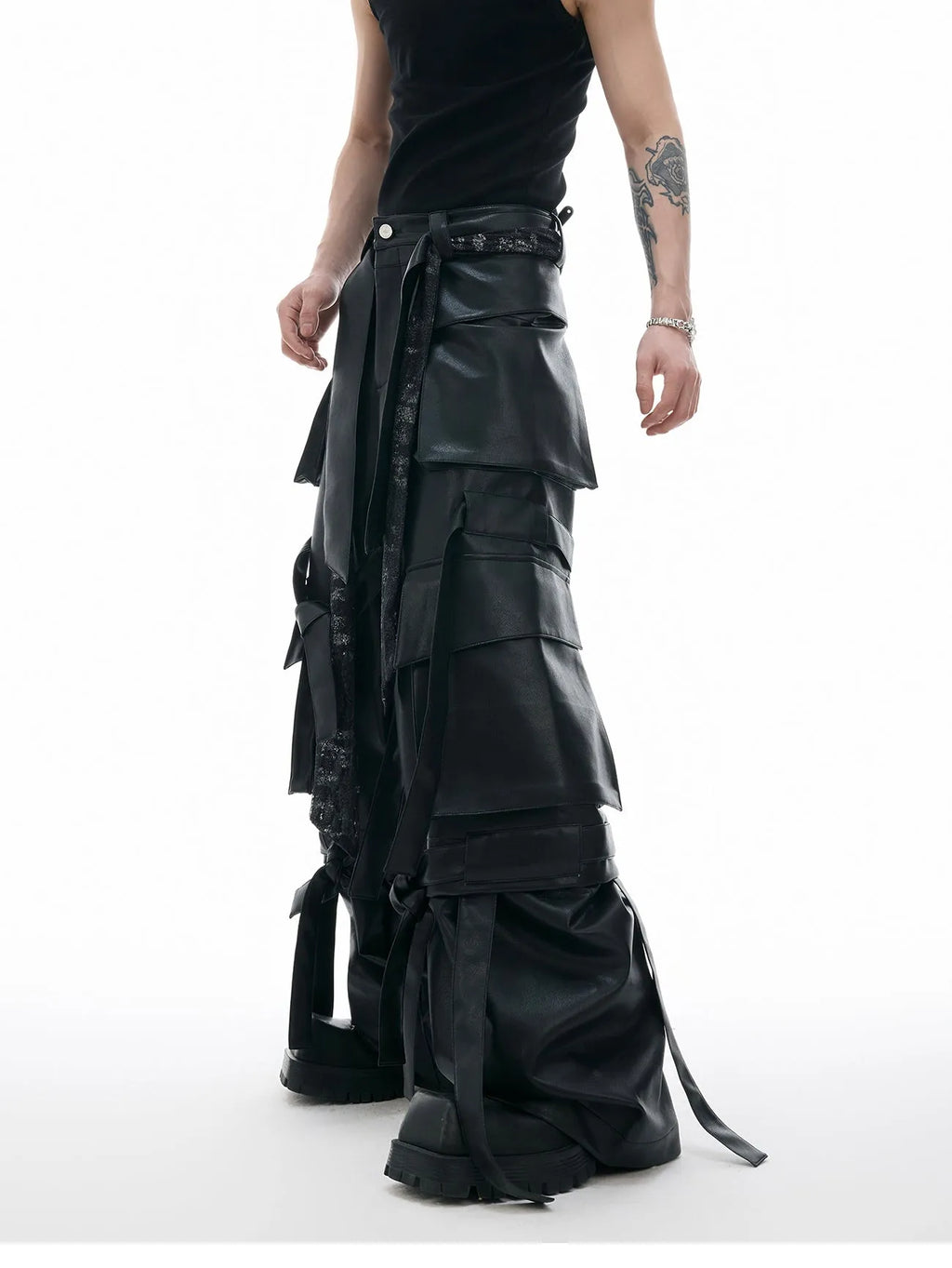 Black quilted leather pants with multiple pockets and decorative stitching ribbon details