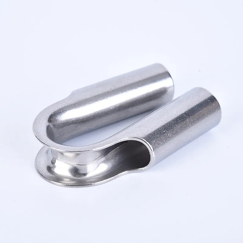 Stainless steel tubular chicken heart shaped sleeve ring set showing various metric sizes on a workbench.