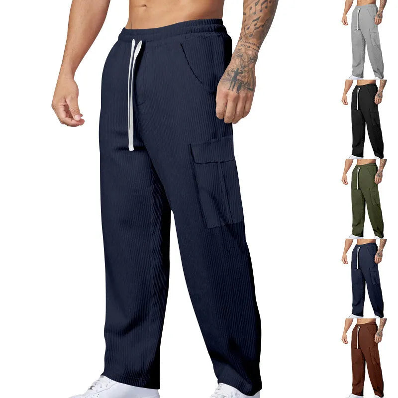 Men's loose-fitting corduroy cargo trousers in army green with a straight leg and drawstring waist.