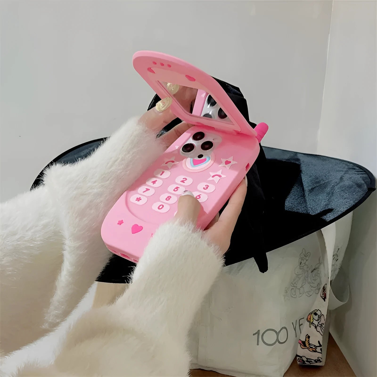 Light pink silicone flip phone case with a built-in mirror, shown next to a rose red version.