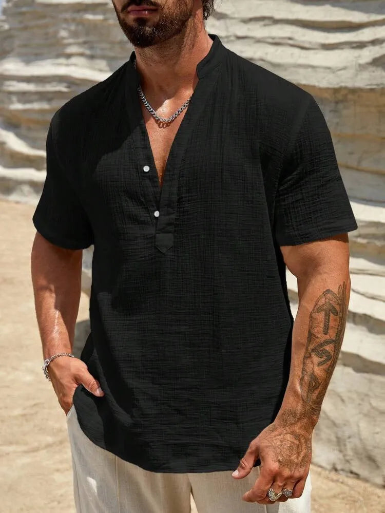 Man wearing a light blue stand collar short-sleeved casual shirt for summer.