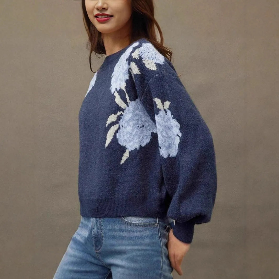 Sapphire blue women's loose pullover with floral jacquard pattern and off-neck design.