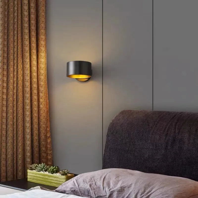 Modern simple copper wall lamp shown in gold and black finishes for living room use.