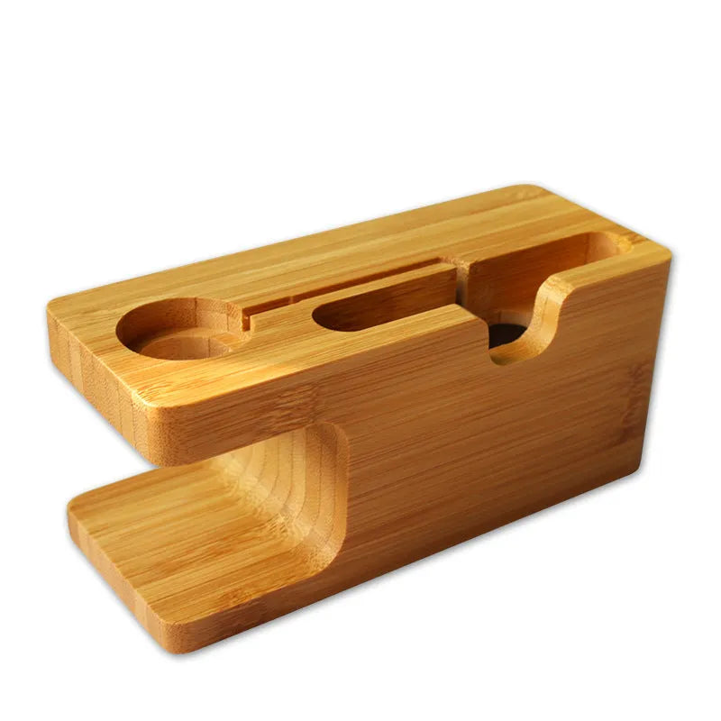 Bamboo phone and watch stand with carved design measuring 149mm wide