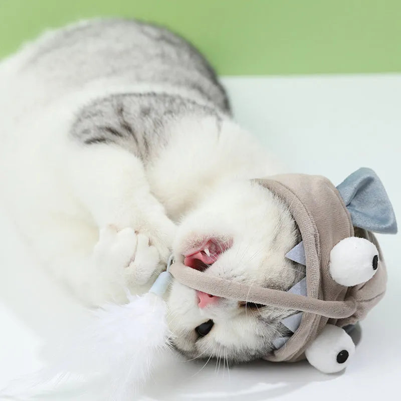 Grey dinosaur feather head teaser cat toy with adjustable neck strap for hands-free indoor play.