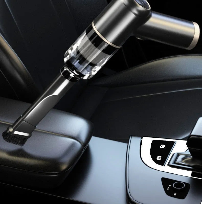 Black wireless car vacuum cleaner with accessories including nozzles and brush heads