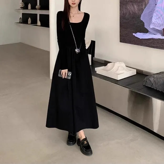 Women's black knitted square collar A-line dress with long sleeves and an elastic waist.