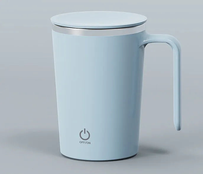 White automatic electric stirring cup with stainless steel finish and minimalist design on a table.