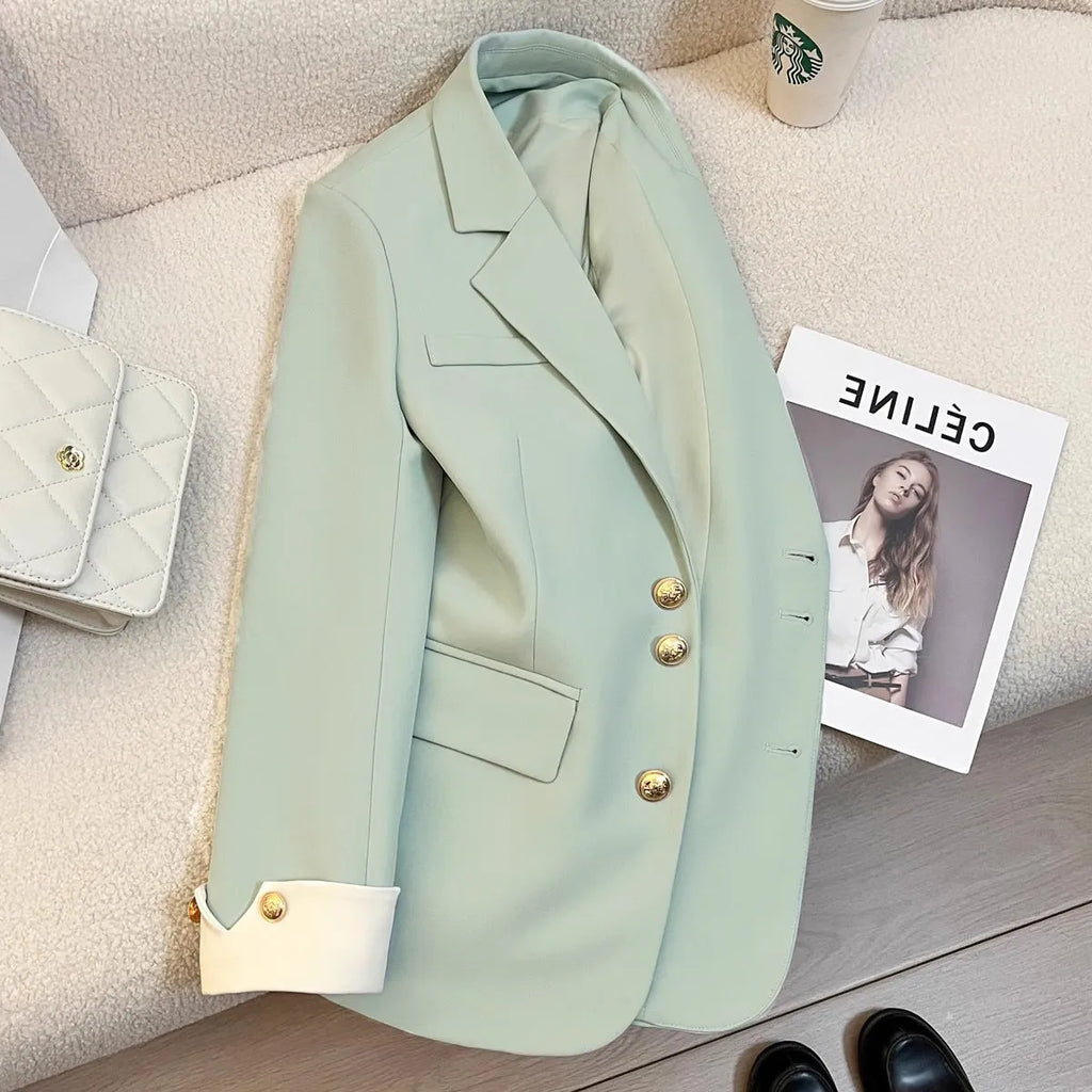 Korean style loose fit women's coat in milky white, shown with long sleeves and pockets.
