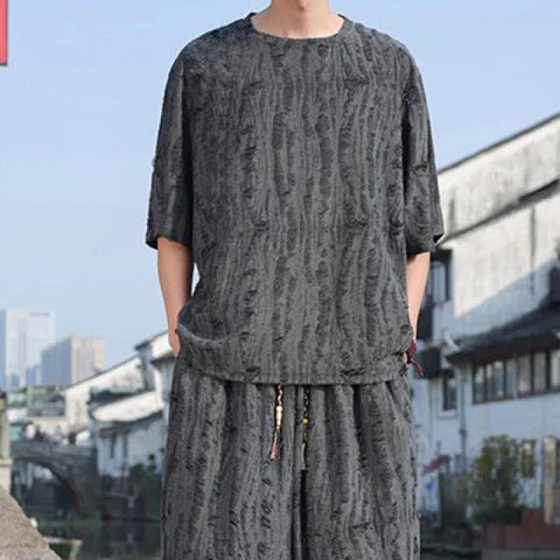 Men's loose two-piece summer suit set with thin short-sleeved top and cropped trousers in black or grey