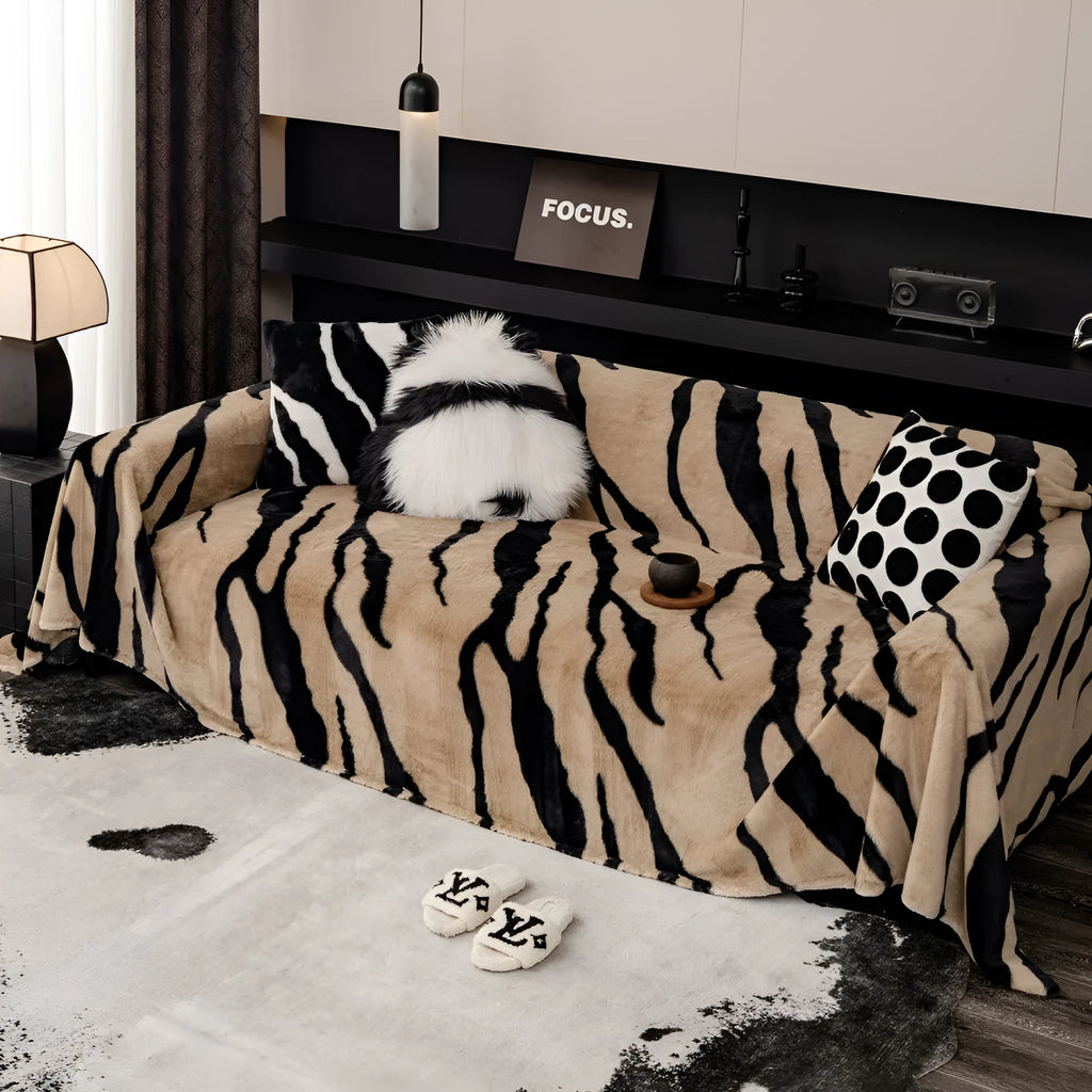 Zebra pattern flannel sofa cover with matching pillowcase in a light luxury style.