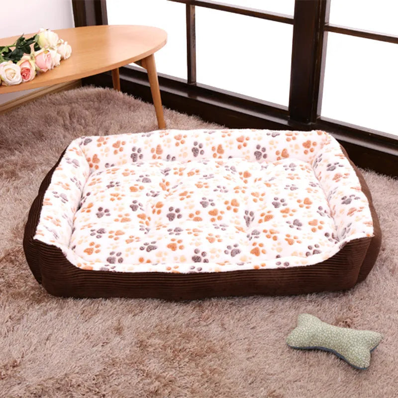 Beige plush sofa-style dog bed mat with raised sides for a small dog, shown next to size chart.