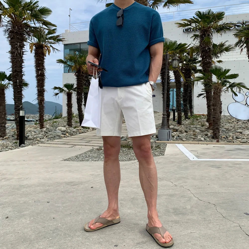 Men's straight-leg casual shorts in solid black colour, laid flat to show loose fit.