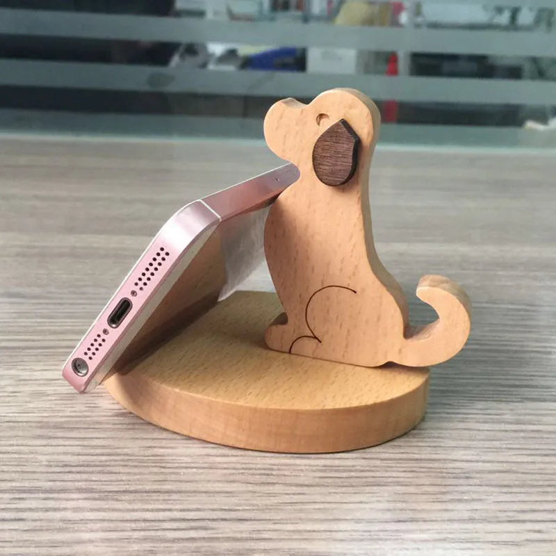 A decorative resin mobile phone stand holding a smartphone, shown in an animal design variant.
