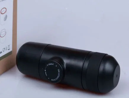 Compact black portable manual coffee machine for espresso, shown with dimensions 6cm by 17.5cm