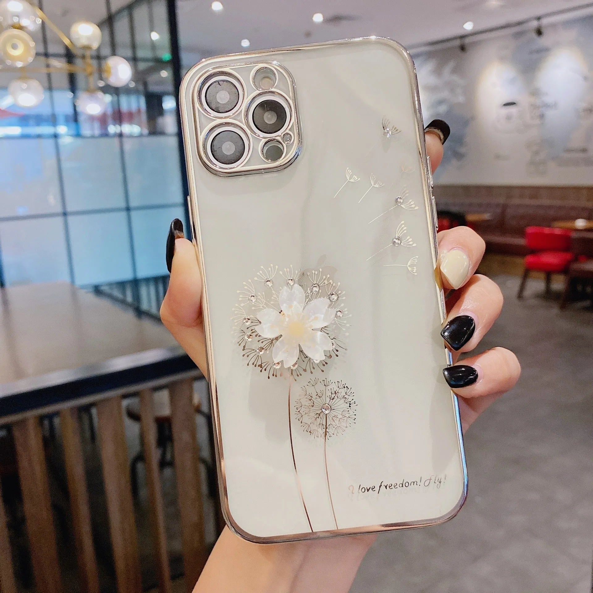 Green iPhone case with a 3D white flower design and a rotating stand on the back.
