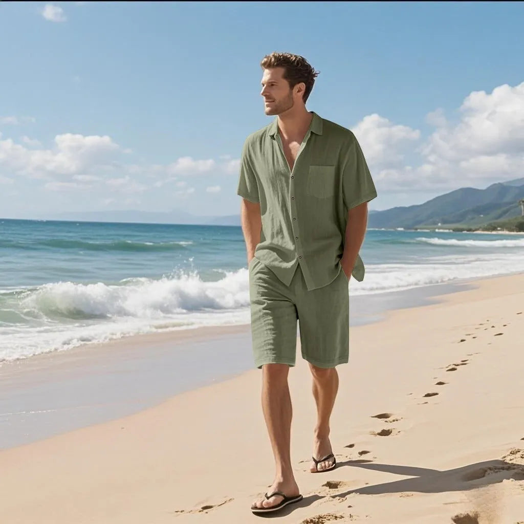 A man's linen blend short sleeve shirt and matching shorts set in a light blue colour, laid flat.
