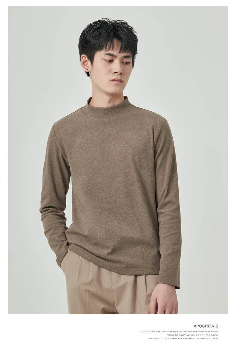 Man wearing a beige Dralon long sleeve T-shirt with a half-high collar, casual autumn outfit.
