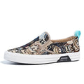 Khaki canvas slip-on sneakers with vulcanised rubber sole and mesh lining on a white background.