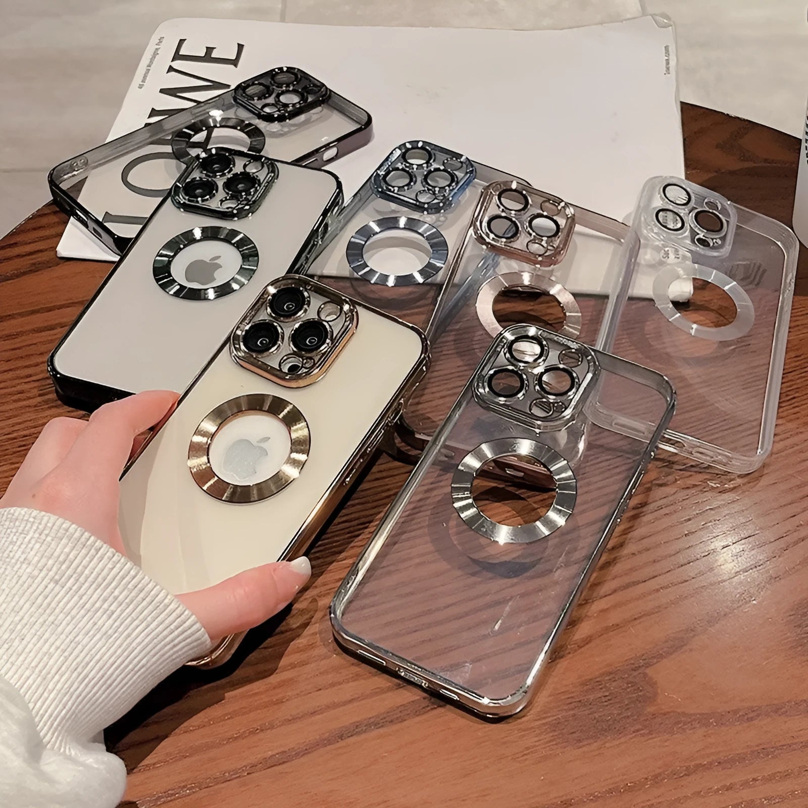 Transparent electroplated silicone iPhone case showing integrated camera lens protector and precise button cutouts