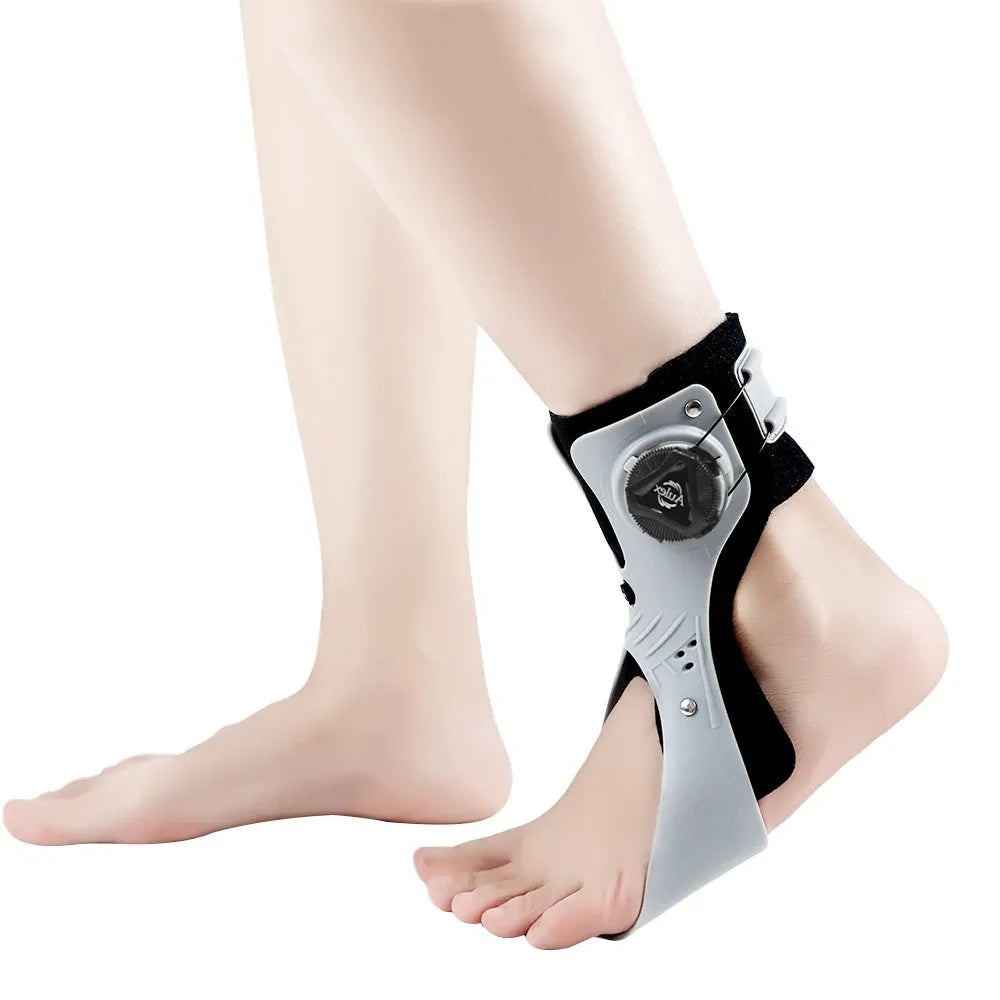 Grey and black ankle support brace with airbag button fixation, shown in left and right foot versions.