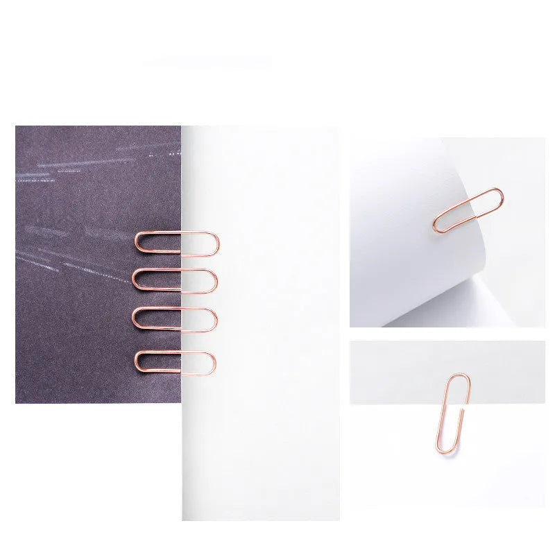 Rose gold heart-shaped metal paper clips measuring 28mm with steel core construction