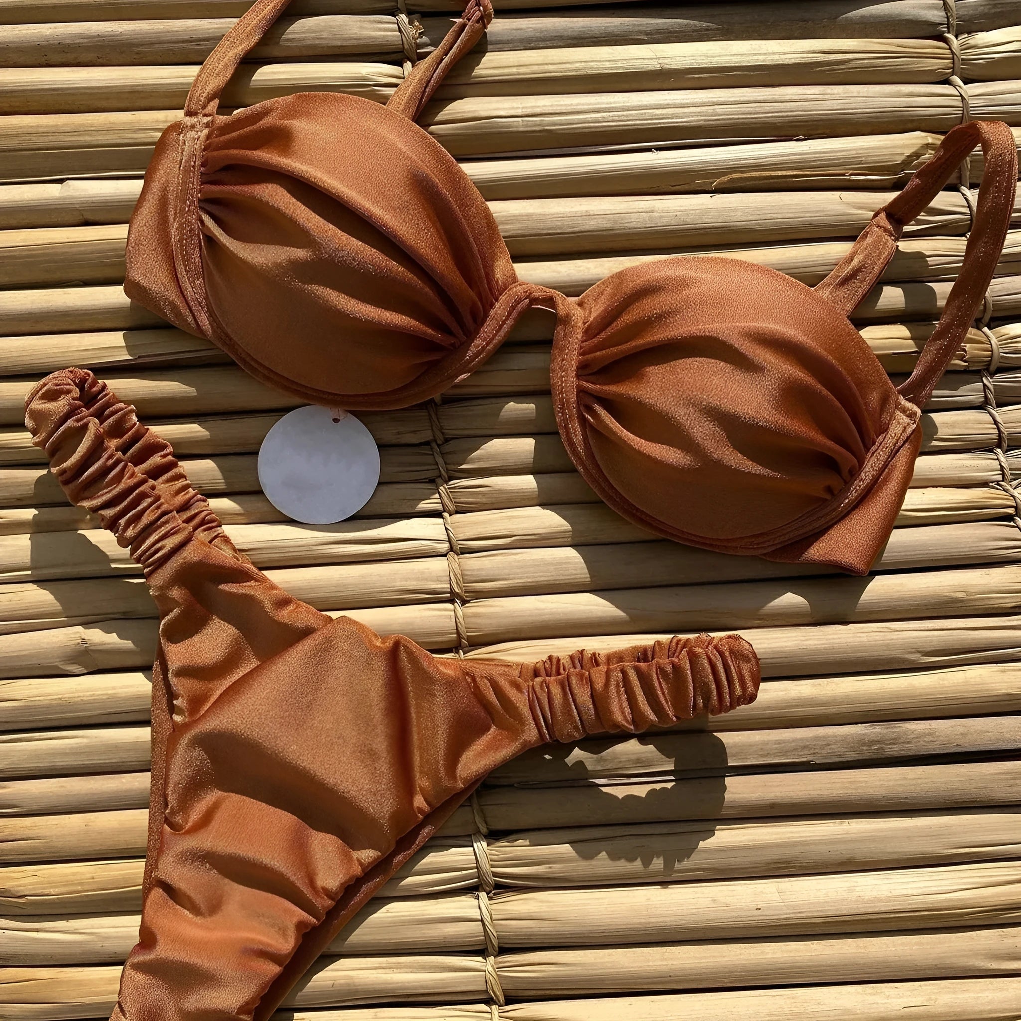 Women's black underwire bikini swimsuit set with split briefs on a mannequin.