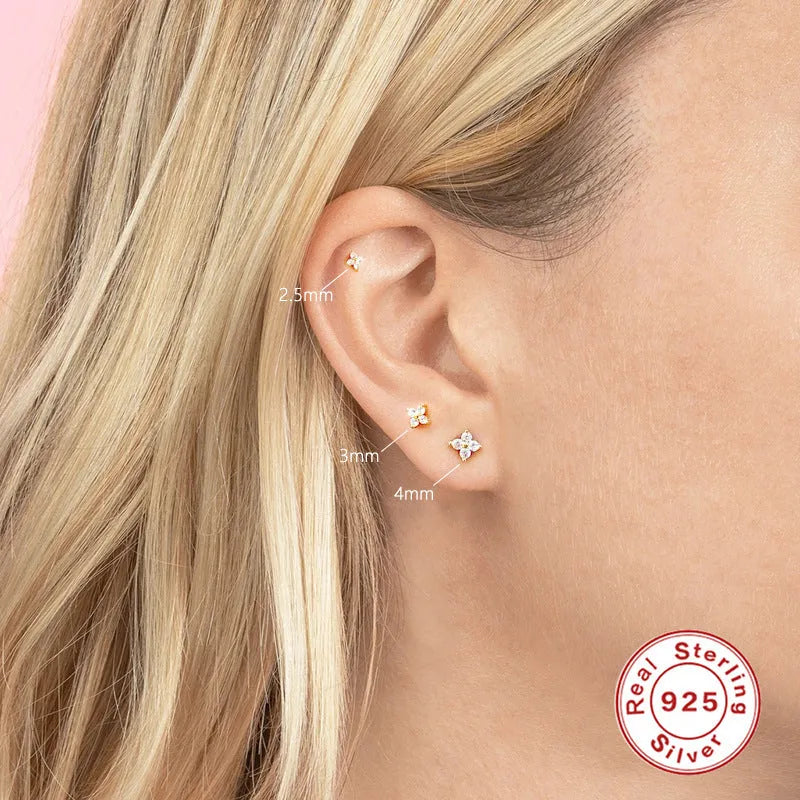 S925 sterling silver stud earrings with a petal-shaped crystal flower design in gold or platinum plating.