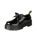 Women's black thick soled leather shoes with cross strap and ribbon lacing closure