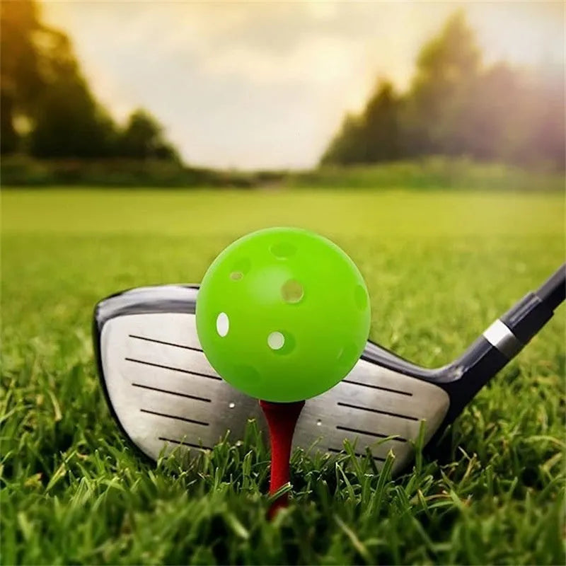 Multi-colour 42mm polyethylene golf practice balls in a net bag.