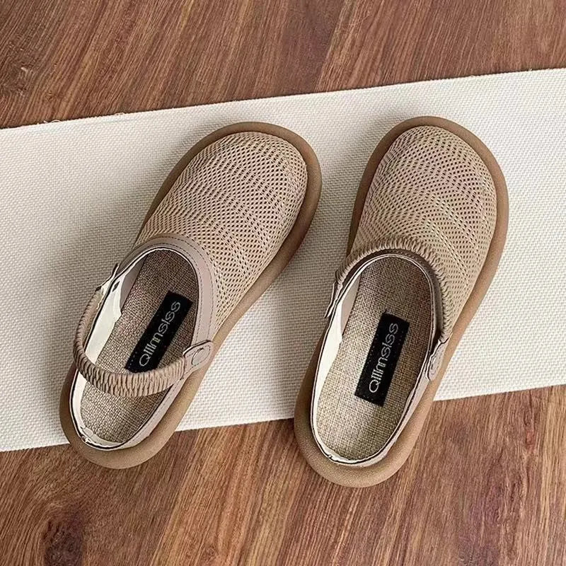 Beige linen slip-on shoes with a round toe and breathable mesh lining on a soft rubber sole.