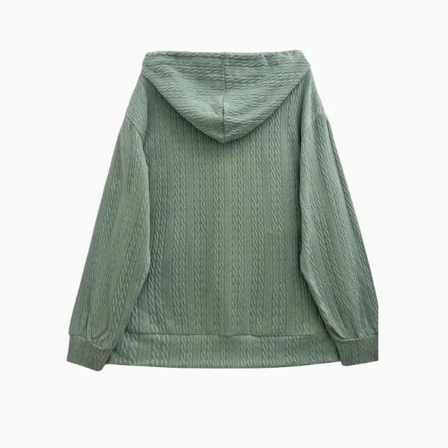 Green womens hooded zip-front sweater coat on a hanger