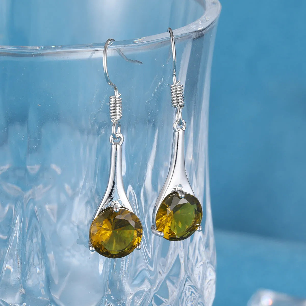 Olive green topaz drop earrings with water drop shape and minimalist retro design
