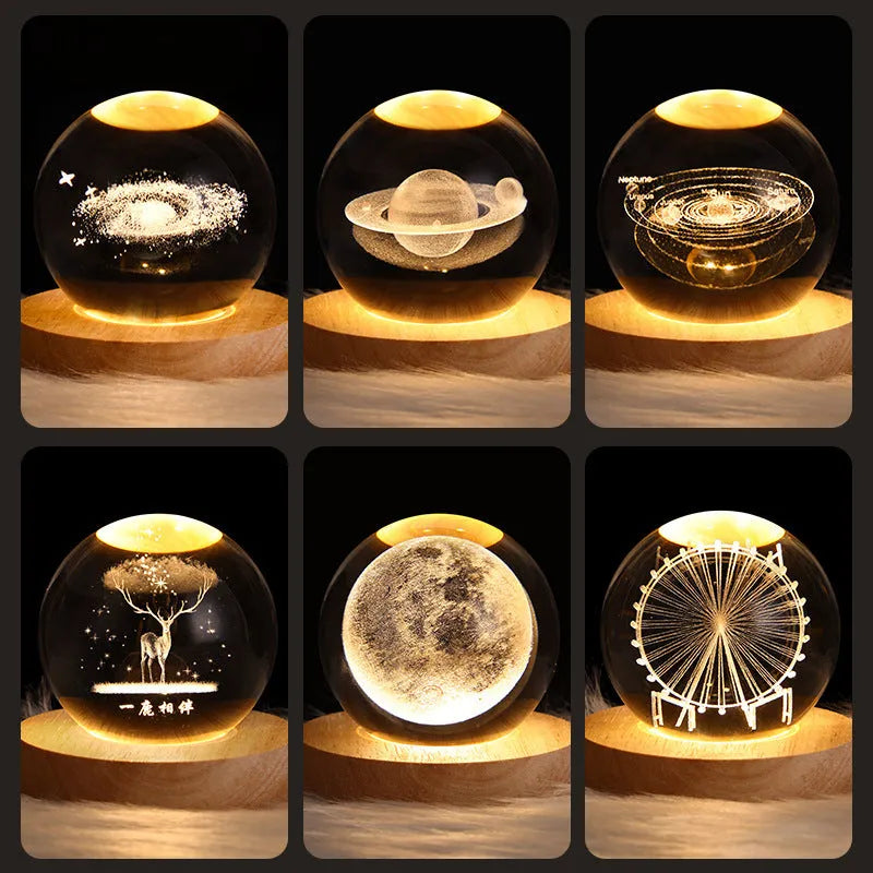 LED galaxy crystal ball night light with 3D planet designs on a table