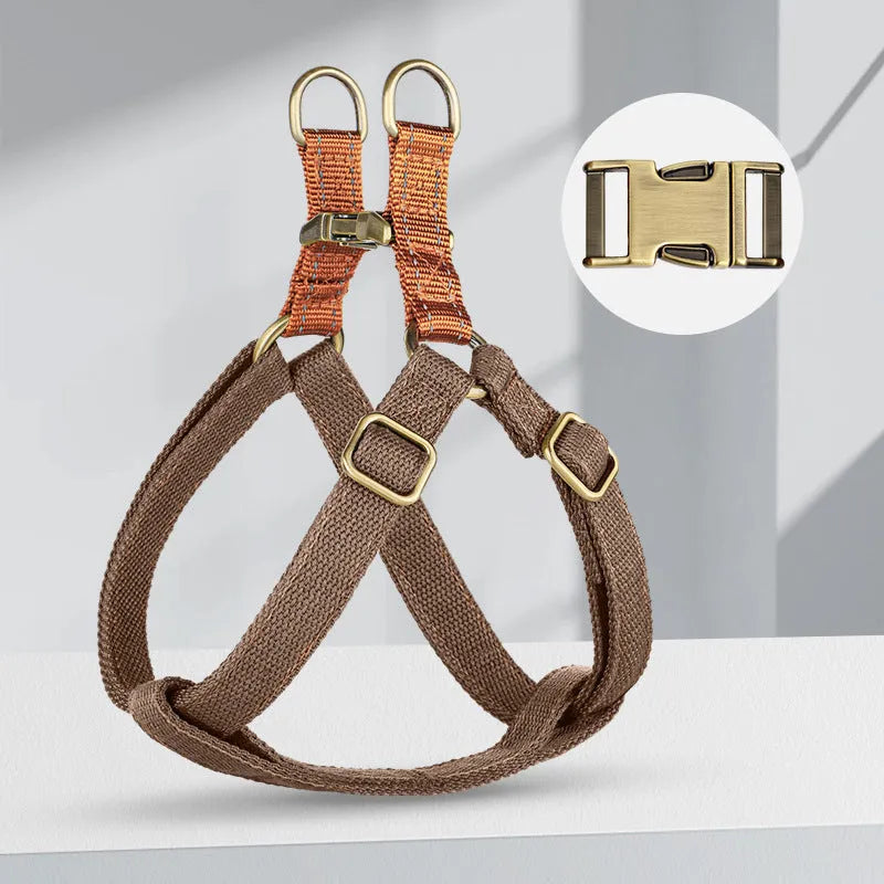 Brown vest-style dog leash harness on small dog showing chest design and alloy fastener