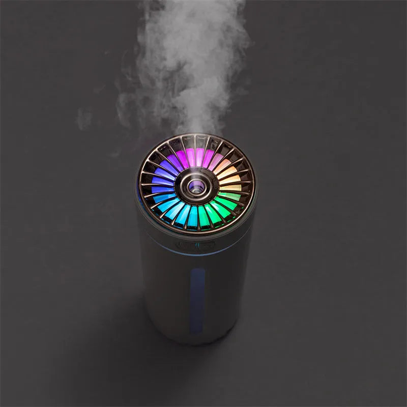 Black portable USB rechargeable humidifier with colourful LED lights on a car cup holder