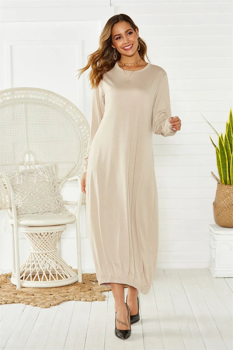 Women's loose black lantern dress with lace-up crew neck and long sleeves.