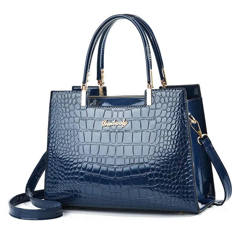 Women's one-shoulder handbag in horizontal square suitcase shape made from medium-hard PU leather