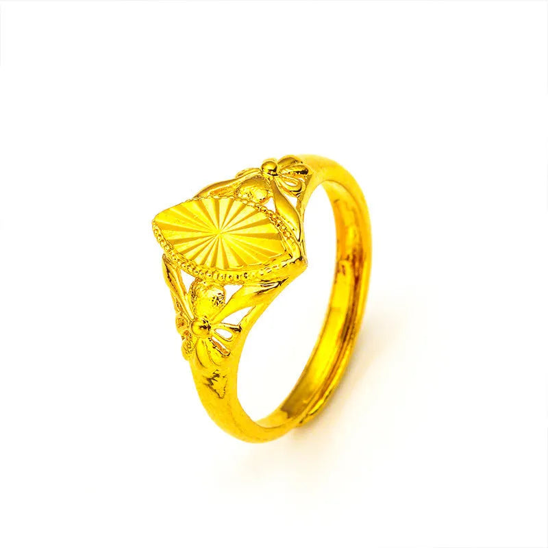 Gold electroplated brass ring with geometric open diamond flower design and textured surface