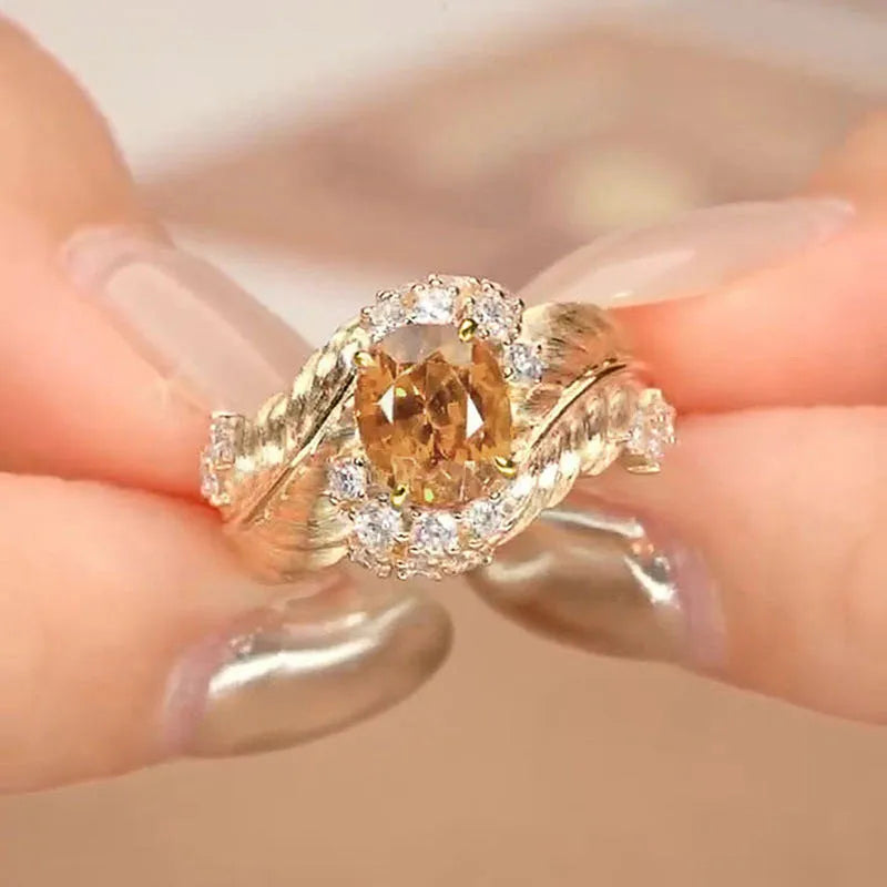 Women's feather embossed copper ring with geometric design and yellow zircon stone inlays