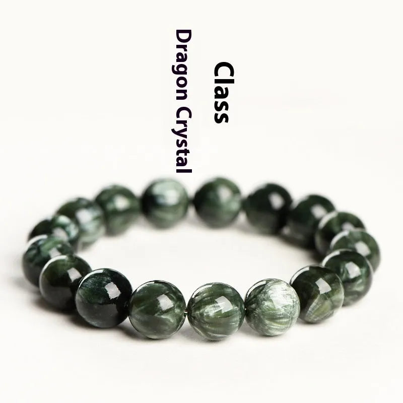 Natural green dragon crystal round bead bracelet with ruyi detail on a white background.
