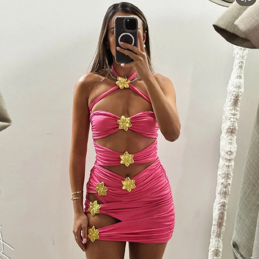Women's solid colour one-piece swimsuit with hollow out tube top and matching short skirt.